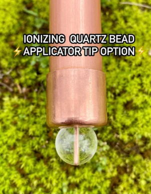 Ionizing quartz bead applicator tip on a green moss background with text overlay.