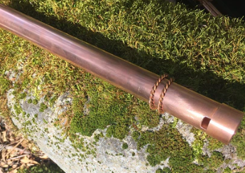 Copper pipe on a natural background