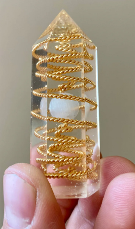 crystal object with crystal sphere and gold braided spiral 