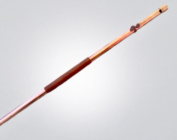 copper flute on a gray background
