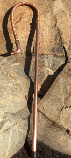 Copper pipe on a stone surface